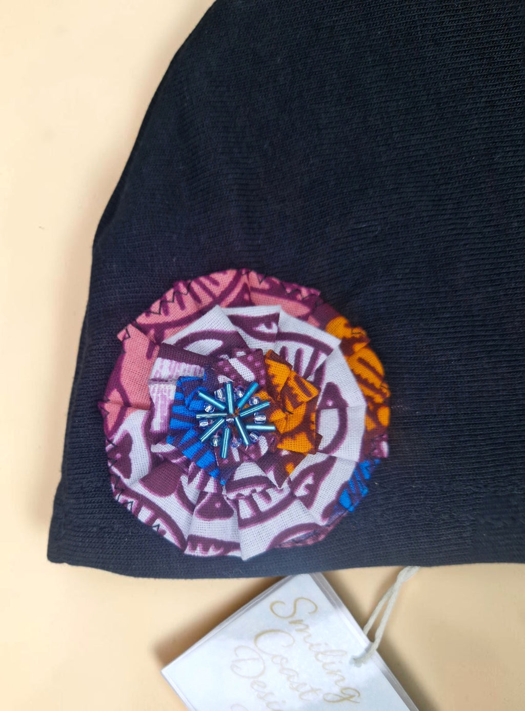 Baby Beanie with African waxprint Fabric Flower and hand-sewn beads/ Size 0-6 Months (199kr)