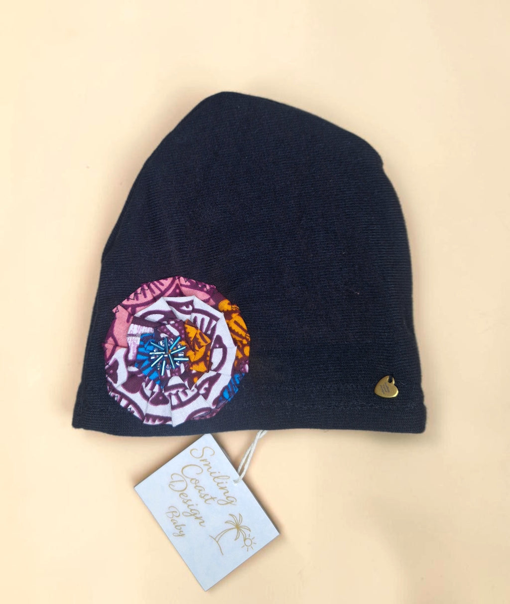 Baby Beanie with African waxprint Fabric Flower and hand-sewn beads/ Size 0-6 Months (199kr)