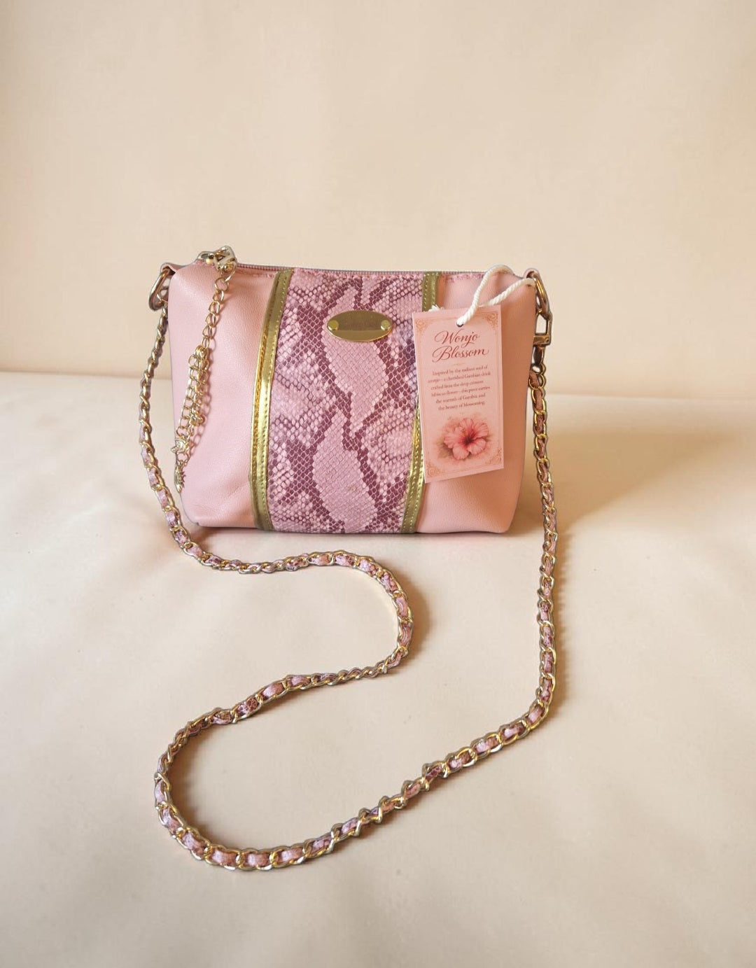 Pink snake crossbody bag (695 kr)
